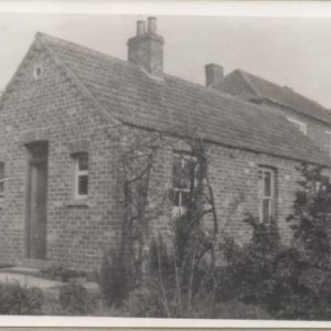 This building is in the garden of The Hall, Marshchapel (2024). Its purpose is unknown but may have been a workshop, staff accommodation etc.