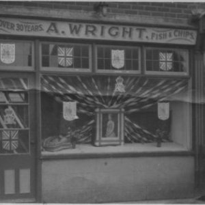 This photograph was taken when the Fish & Chip Shop was decorated to celebrate the coronation of Queen Elizabeth 11 which took place on 2 June 1953.