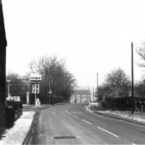 View looking down Sea Dyke Way towards the garage - Note the price of petrol!
(Petrol £1.34 per litre, May 2013 - The price quoted above would be for a gallon).