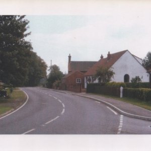 Sea Dyke Way, Marshchapel
The turning to Church Lane can be seen in the bottom of the photograph
The first property on the right was built in the garden of the first house on the left in Church Lane. The second propert (white bungalow) replaced a cottage which looked similar.
The third on the right is the Old Bakery.
The date is unknown but from a series of photographs that came with this one it could be from mid 1970s onwards.