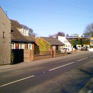View down Sea Dyke Way showing the garage when petrol was sold there.