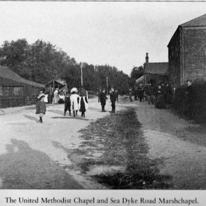 This photogaph was probably taken in the early part of the 1900s.
It appears to be a village/Chapel function taking place near the United Methodist Chapel which used to be near the War Memorial.
On the left, towards the back of the picture, can be seen a stall which may have been serving refreshments.