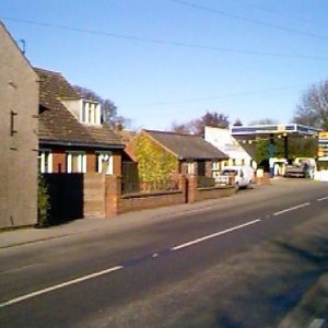 View down Sea Dyke Way, showing the garage when petrol was sold there.