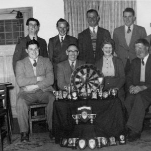 North Cotes Darts Team, who from the amount of trophies, were pretty good. This would probably be The Fleece pub team.
Back Row - L to R; Unknown, Unknown, Frank Miller, Unknown, Tank.
Front Row - L to R; Ray Elvidge, Unknown, Unknown, Derek Kirman.