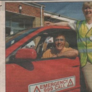 2003. Marty Wilde with the Marshchapel First Responders. 
Leaning on the vehicle is Judy Draycott (now Burgess), Jan Irving at the back and on the right Ann Frith. This photograph was taken at Marshchapel Village Hall.