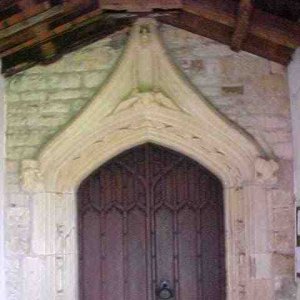 The beautiful stone carving over the door which has been protected over the years by the porch.