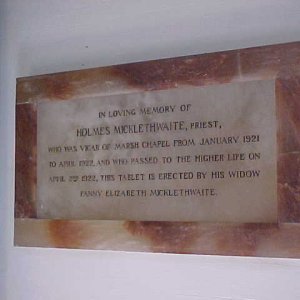 Memorial plaque to a former vicar.
