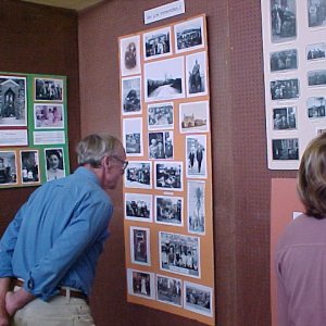 John Gilby looking at old photographs of Marshchapel folk.
