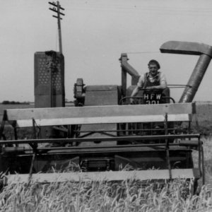 Bob Dunkin driving a Combine  - Probably late 1950s to early 1960s.