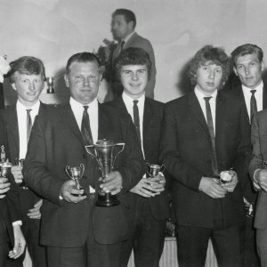 L to R; Pete Clarke, Stuart Smith, Edwin "Pop" Ireland, Frank Shephard, Stephen Pearson, Dave Atkin, Terry Taylor.
Unknown trophy presentation.