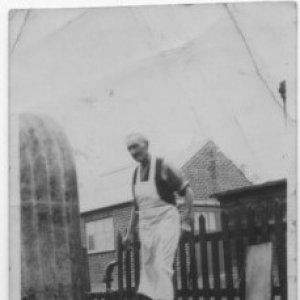 Alf Wright. 
This photograph was taken in the back yard of the Fish & Chip shop on the main road in Marshchapel between the Methodist Chapel and what was the Greyhound Inn.
The corrugated iron structure was where the potato "rumbler" stood.  This was a large drum that was filled with potatoes and water and on turning the handle it would peel the potatoes ready for chipping.

In the background can be seen a building used by the butchers shop which was next door.
