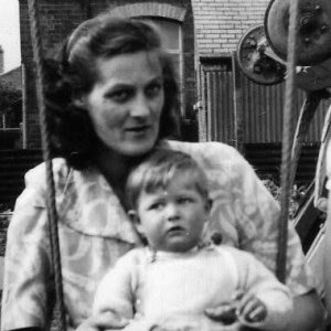 Barbara Whiteley with son Ray on the swing in the back garden
of Frank Whiteleys Butchers Shop on sea Dyke Way, Marshchapel.