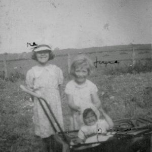 Left to right: Betty Clover with her sisters Joyce and Desiree in the pram.
This potograph was taken in the garden of Lapstone Villa, Sea Dyke Way, Marshchapel probably some time in the early 1940s.