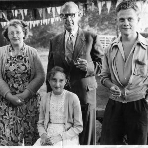 Church Garden Party held at the Vicarage - now The Limes, in Church Lane.
C. 1951 or 1952
Left to right: Marion Lyons, Percy Lyons - her father and at the time Headmaster of Marshchapel School until 1952. Next to him is his son Colin Lyons and seated is Julie Lyons -Marions daughter.