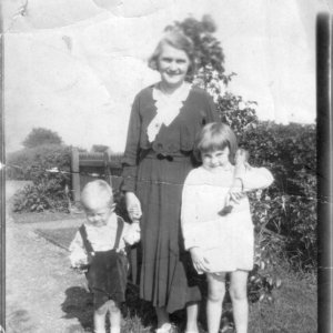 Colin, Nora and Jean Lyons
The photograph was taken in the School House garden in Mill Lane in 1932