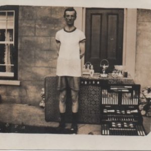 George Bancroft Burgess displaying his trophies.
This photograph was taken at West End House in West End Lane, Marshchapel.