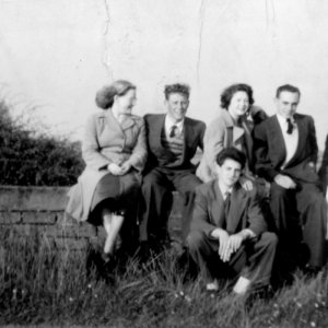 Left to right: Jennifer Leak, Julien Jackson, Midge Marshall, Trevor Nicholson, Marie Lingard and at the front Evan Alexander.
This photograph was taken in 1955 on the parapet of the bridge which is past the Church further down Church Lane on the way out of the village.  The parapet hasnow been replaced with a railing.