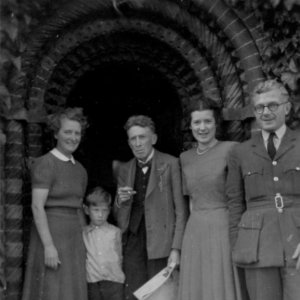 Left to right: Dorothy Jackson, son Julien, Sydney Jackson,
together with an officer and his wife who were billeted with them during WW2.
The photograph was taken outside the door of Norman Cottage in the early 1940s.