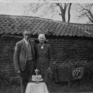 The Golden Wedding celebration of Joseph and Florence Elvin.
This photograph was taken at the back of their cottage on the corner of Sea Dyke Way and North Lane.
A range of outbuildings ran at right angles from the cottage down North Lane.
Joseph died 9 May 1952