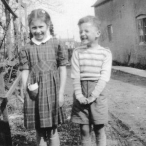 Jennifer and John Pepper.
This photograph was taken in the garden of their cottage next to the school. C. 1950s
The cottage has now been demolished.