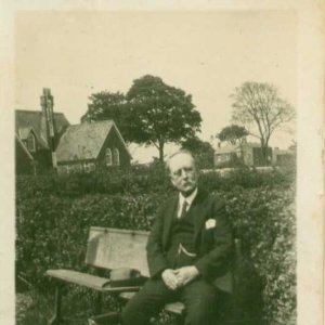 It is thought this might be a photograph of Fred Wray, the village baker.
The school and White Horse Inn can be seen in the background.