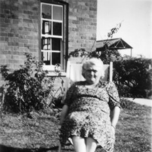 Nora Lyons - Teacher at Marshchapel School.
This phtograph was taken in the School House garden in around 1948.
In the background can be seen the roof of the stationary pea viner which was situated in Mill Lane.