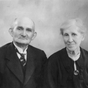 George Arnold Pearce and his wife Jane.
They lived in a cottage opposite the old Chapel near the War Memorial on Sea Dyke Way. The cottage was in front of the Village Hall and has since been demolished.
George was a lay preacher for 20 years.
George died 17 Otober 1950 aged 80 and Jane died 11 May 1955 aged 80.