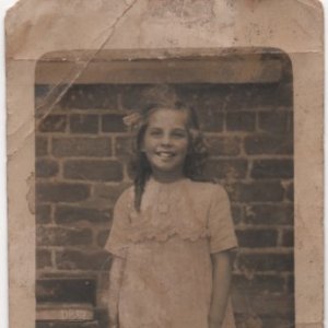 This photograph is of Phyllis who was the daughter of Alf and Beatrice Wright who ran the village fish and chip shop.
Although the photograph has no date on it, it was probably taken in the early 20th Century.
She went on to run the village fish and chip shop for many years.