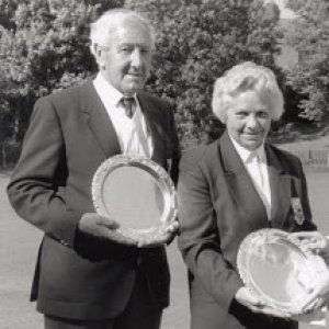 Raymond and Margaret Burgess with their bowling trophies.