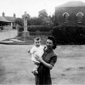 Kath Grantham with her son Stuart.
This photograph was taken in 1945.
In the background on the right can be seen the Methodist Chapel - now demolished - and on the left is the office of Riggalls Workshop - also now demolished.
Further in the background can be seen "The Sycamores" - now demolished.