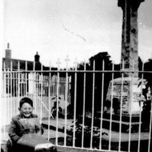 Stuart Grantham in his first car.
This photograph was taken near the War Memorial on the corner of Sea Dyke Way and Church Lane.