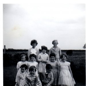 This photograph was taken in the 1960s.
Back Row - L to R; Val Jacklin and Ann Smith.
Middle Row - L to R; Karen Smith, Lynne Jacklin, Unknown, Anne Oxborrow, Marlene Horry.
Front Row - L to R; Mandy Evison, Unknown, Martin Evison.