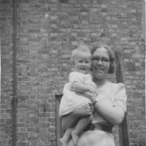 Jennifer Leak being held by a soldiers wife.
Photograph taken at Clyde House, Marshchapel during WW2. C. 1940