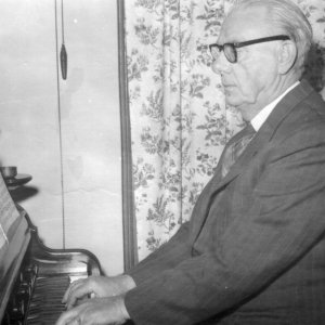 Percy Lyons playing the organ at his home in Hallgarth, Marshchapel.
This photograph was taken not long after moving into what was a new council house. C. 1952.