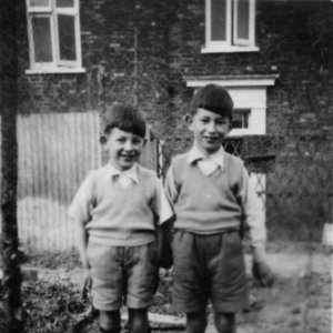 Richard and Peter Marshall.
This photograph was taken c. 1949 in the garden attached to the corner shop -Sea Dyke Way and Littlefield Lane - which was owned by their parents.