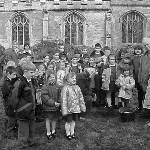 Children from Marshchapel School helping to plant the Millenium Yew Tree in the Churchyard