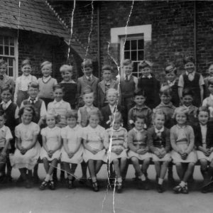 Photograph taken in Marshchapel School playground.
Back row: L - R: Teacher, Mrs Newton, Unknown, Unknown, Stephen Wray, 3rd from end Chris Leak, Mick Grantham, and Stuart Grantham.
Middle row: Clive Darke, Unknown, John Stones, Graham Atkinson, Graham Clayton, Unknown, Unknown, Peter Marshall, Roger Portess.
Front row: Unknown, Unknown, Diana Duncan, Sandra Wilson, Catherine Lingard, Unknown, Josephine Riggall, Patricia Alexander - rest of row unknown.