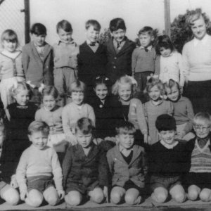 Photograph taken in Marshchapel School playground c. mid 1950s.
Back row: Unknown, Johnny Jennings, Stuart Wright, Roy Nicholson, Johnny Lingard, Colin Darke, Unknown.
Middle row: Christopher Nickerson, Linda Leak, Pat Portus, Linda Lovett, Jennifer Pepper, Maureen Carter, Sheila Worrell, Jacqueline Lewis.
Front row: Stephen Pearson, Michael Fisher, Geoff Bartholemew, Philip Leak, Terence Alexander, Stuart Smith.