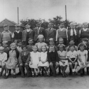 Marshchapel School 1949
Back row: Brian Brooks, Ken Garner, Pat Jacklin, Tony Burgess, Alan Wright, Brian Clover, John Stones, Unknown, Bill Wilson.
Middle row: Peter Marshall, Ray Wilson, Mick Worrell, Mick Grantham, George Worrell, Edna Worrell, John Worrell, David Wray, Richard Marshall, David Evison, Trevor Clover.
Front row: Trevor Osbourne, Steven Wray, Norman Wright, Marie Ireland, David Scrimshaw, The Osbourne Twins, Walter Brooks (perhaps), Doreen Parker, Stuart Grantham, Unknown, Unknown, Unknown, Teacher: Mrs Newton.