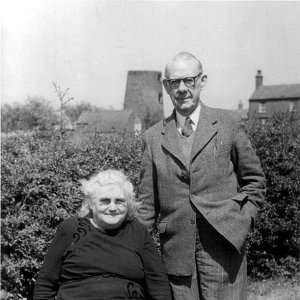 Percy Lyons and Mrs Nora Lyons. This photograph was taken in the garden of the School House in Mill Lane. 
Percy Lyons was Headmaster of Marshchapel School until 1952.
The remains of Marshchapel windmill can be seen in the background.