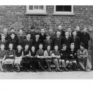 At a guess this group photograph would have been taken in the 1940s.