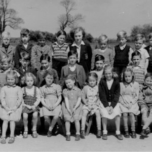 This photograph was taken c. 1949.
Back row: David Scrimshaw, Richard Marshall, Graham Hockney, David Evison, Trevor Clover, Raymond Wilson, Miss Daphne Campion - Infant Teacher - Wright, first name unknown, John Worrell, Unknown, Walter Brooks, Mick Grantham.
Middle row: Bill Wilson, George Worrell, Pat Jacklin, Pete Marshall, John 
Stones, Eddie Lingard, Ken Garner,  Brian Brooks, Clive Darke. 
Front row: Stephen Alexander, Steven Wray, Sandra Wilson, Diana Duncan, Marie Lingard, Unknown, Joyce Manders, Edna Worrell, Doreen Parker, Stuart Grantham, Mick Worrell, Chris Leak.