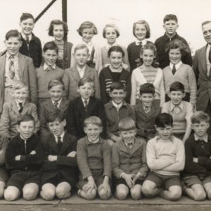 Marshhapel Primary School
Headmaster Mr Hibbert.
This photograph would have been taken early to mid 1950s.
Back row: Unknown, Catherine Lingard, Joyce Manders, Unknown, Sandra Wray, Mick Grantham.
2nd row: Unknown, Clive Darke, Graham Clayton, Jennifer Evison,Unknown,Unknown.
3rd row: Unknown, Unknown, Unknown, Trevor Clover, Rick Newton, Peter Marshall.
4th row: Unknown, Stuart Grantham, David Gigg, Roy Worrell, Chris Leak,Unknown, Unknown.
